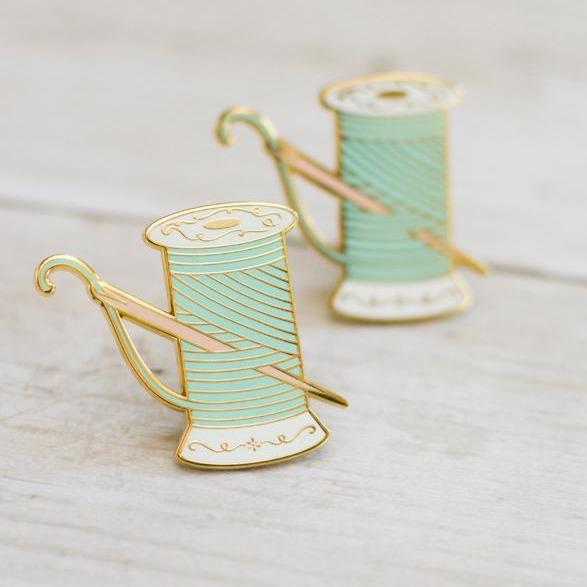 The Gray Muse Needle & Thread enamel pin