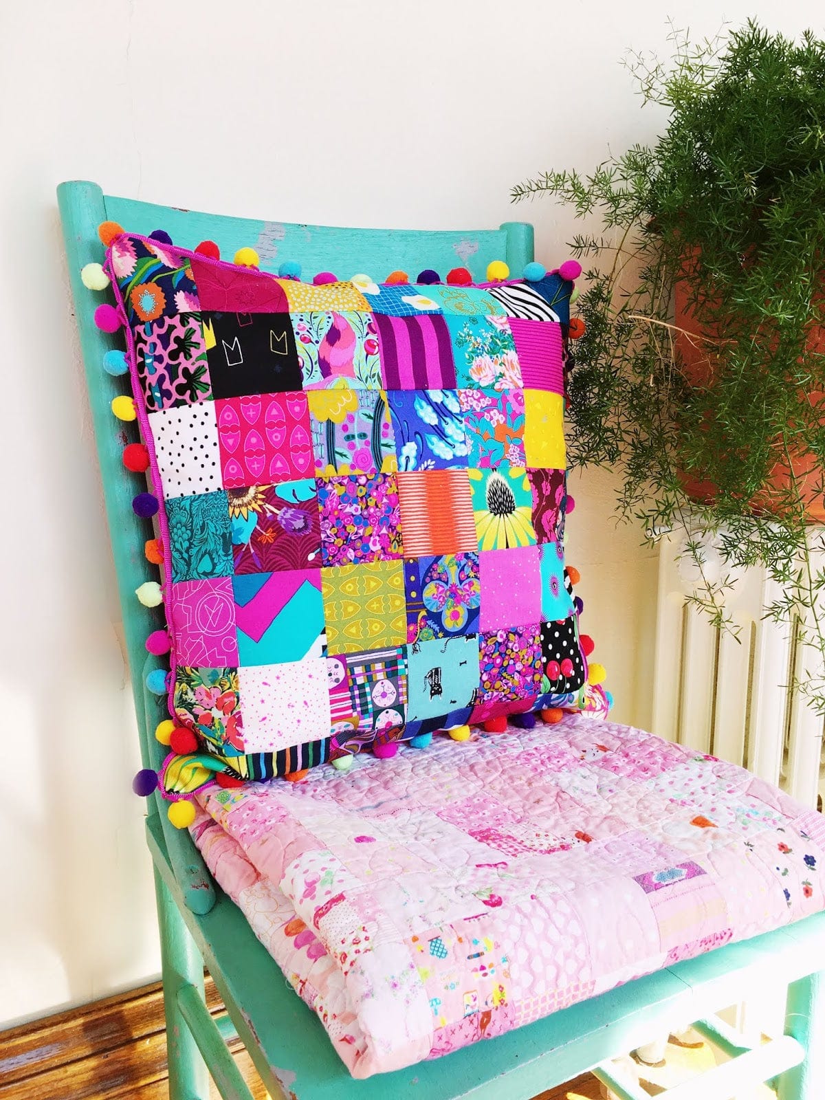 colorful quilted pillow on chair