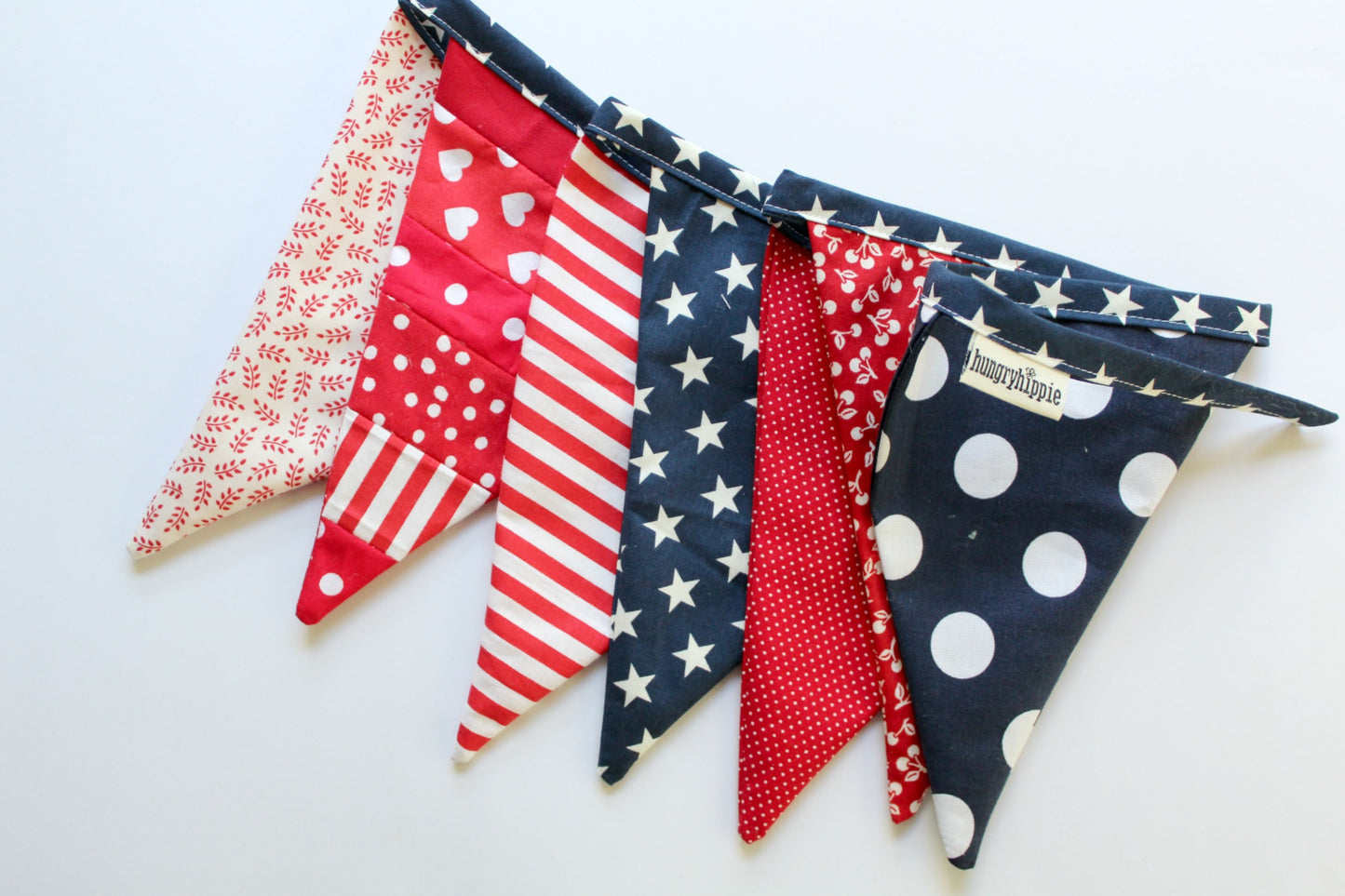 Patriotic banner with red, white, and blue patterns.