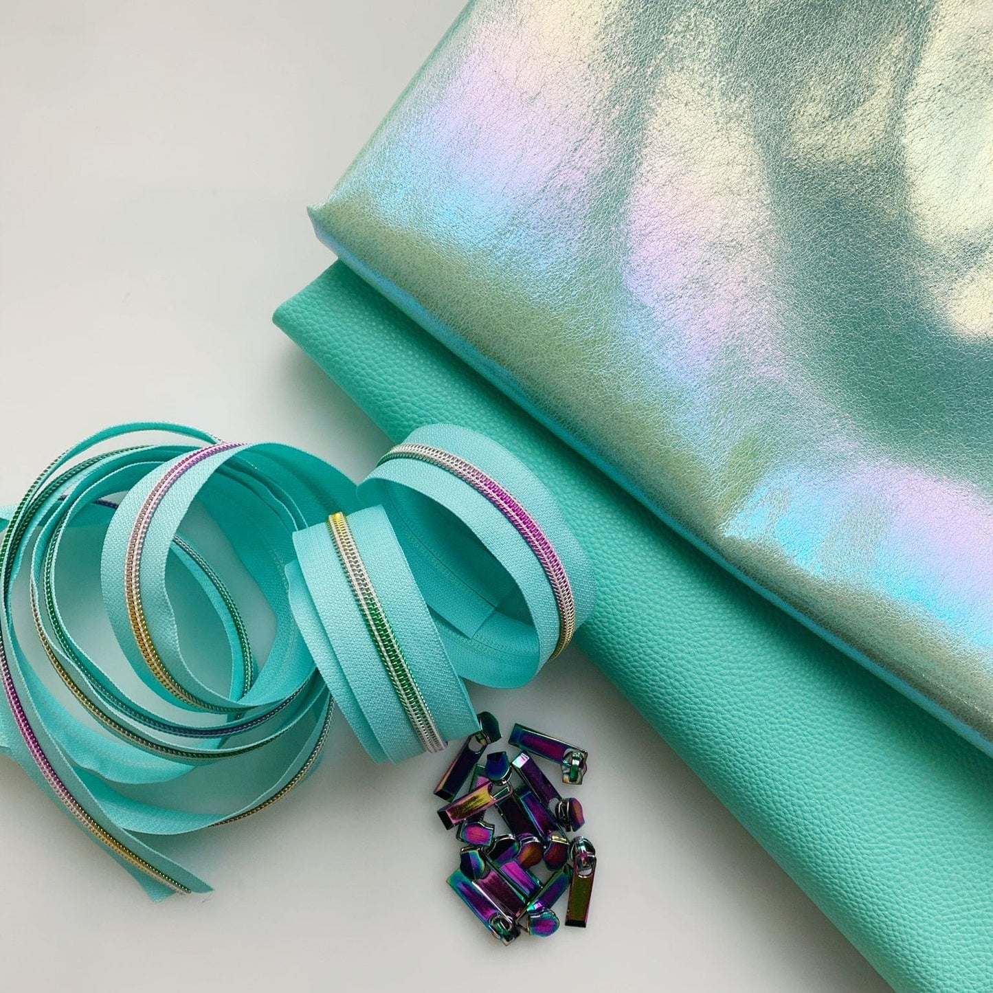 Rainbow zippers and teal fabric
