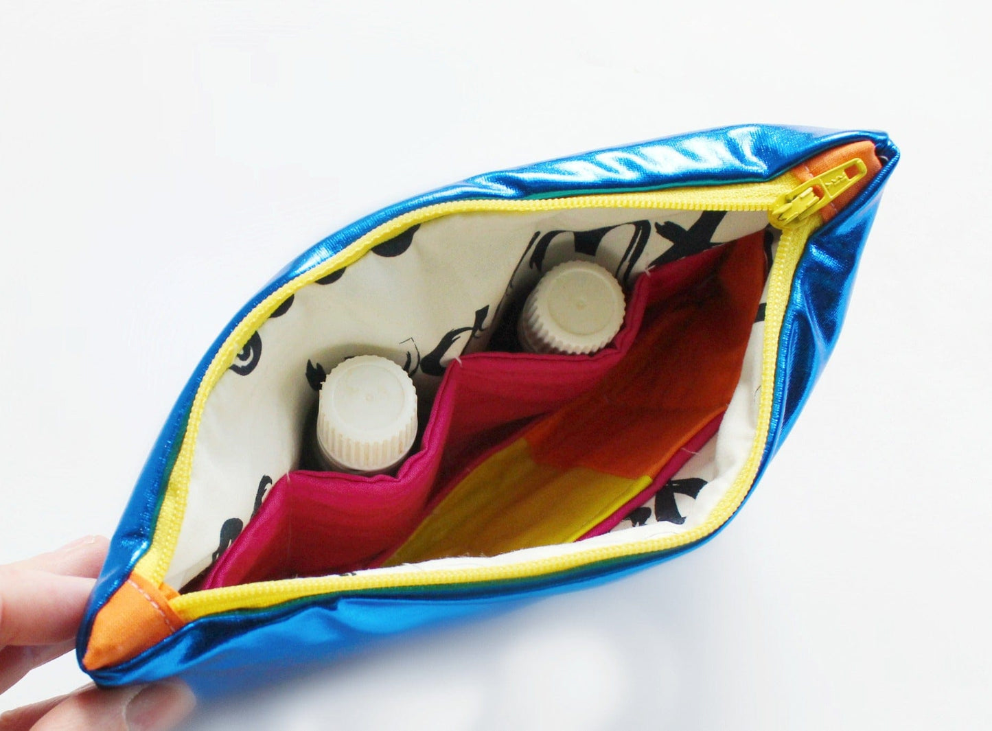 Shiny metallic essential oils case with bottles