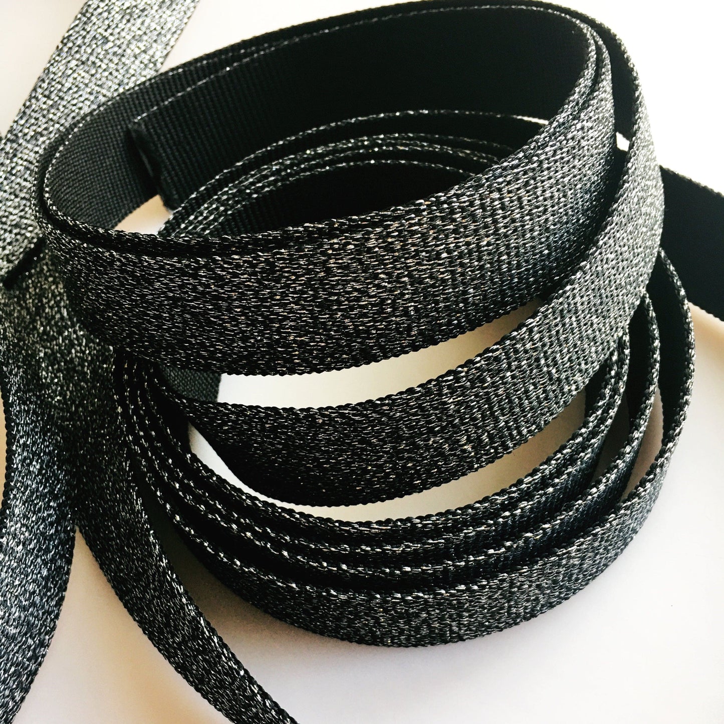Silver and black glitter webbing roll