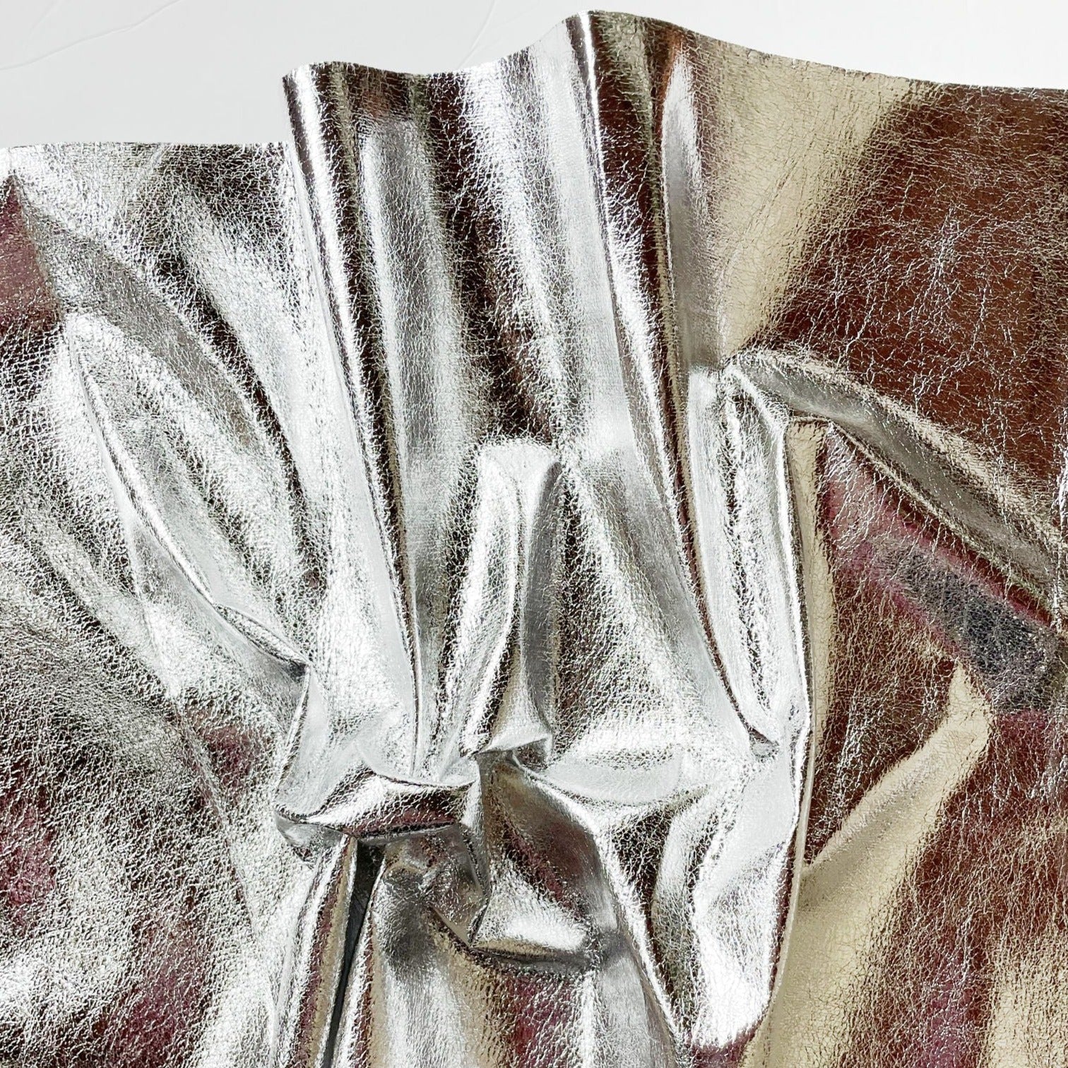 Soft silver vinyl fabric, close-up.