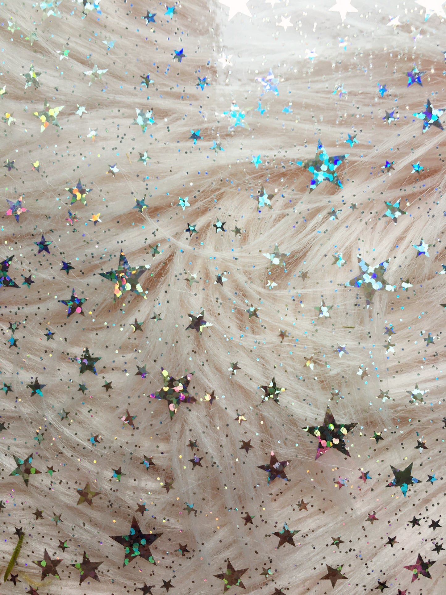 iridescent stars on pale background