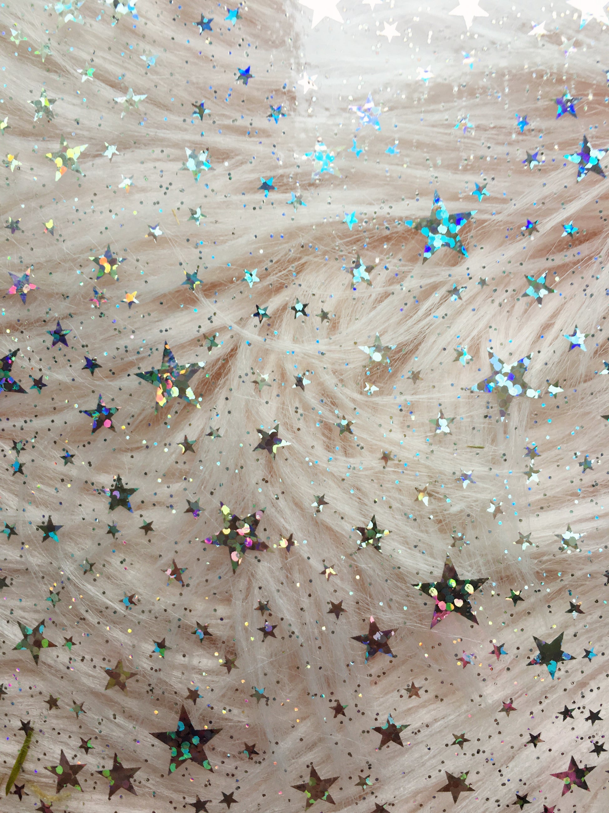 iridescent stars on pale background