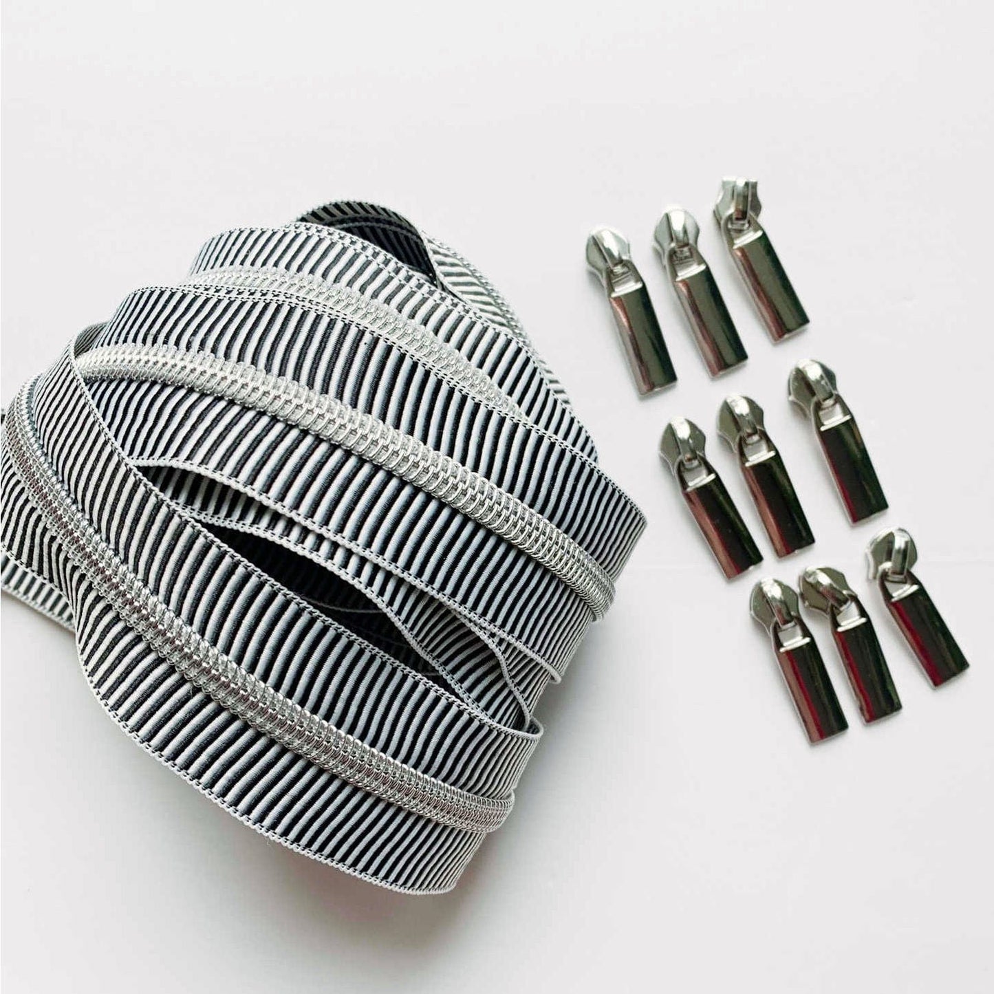 Striped zipper tape with silver pulls