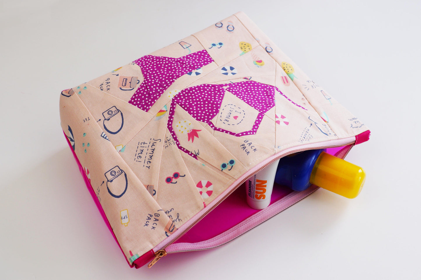 Pink bikini pouch with sunscreen