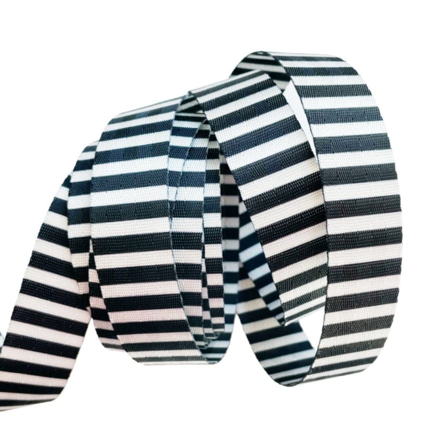 Wider striped black and white seatbelt webbing