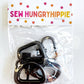 A package of 1-inch gunmetal finish swivel hooks for bag making, branded with a Sew Hungry Hippie header card.
