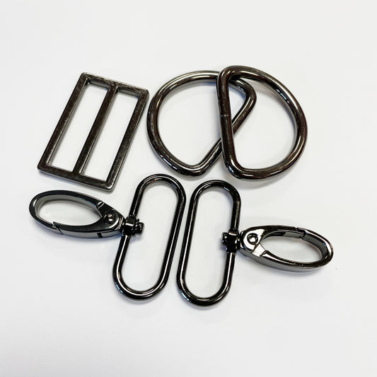 Set of metal hooks and rings on a white background