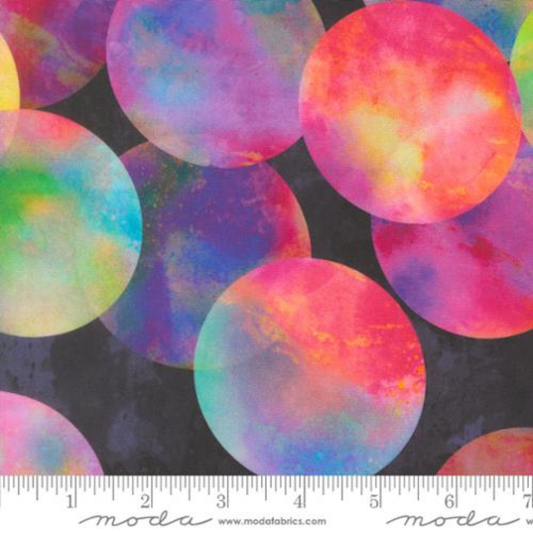 Allover botanical fabric print showcasing layered, softly painted watercolor leaves in an array of warm pinks, oranges, bright blues, and fresh greens.