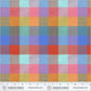 Vibrant rainbow plaid fabric by Windham Fabrics featuring a large-scale gingham or check pattern. The woven texture blends overlapping bands of bright coral red, sunny orange, grassy green, sky blue, and hot pink, complete with a fabric ruler salvage edge at the bottom.