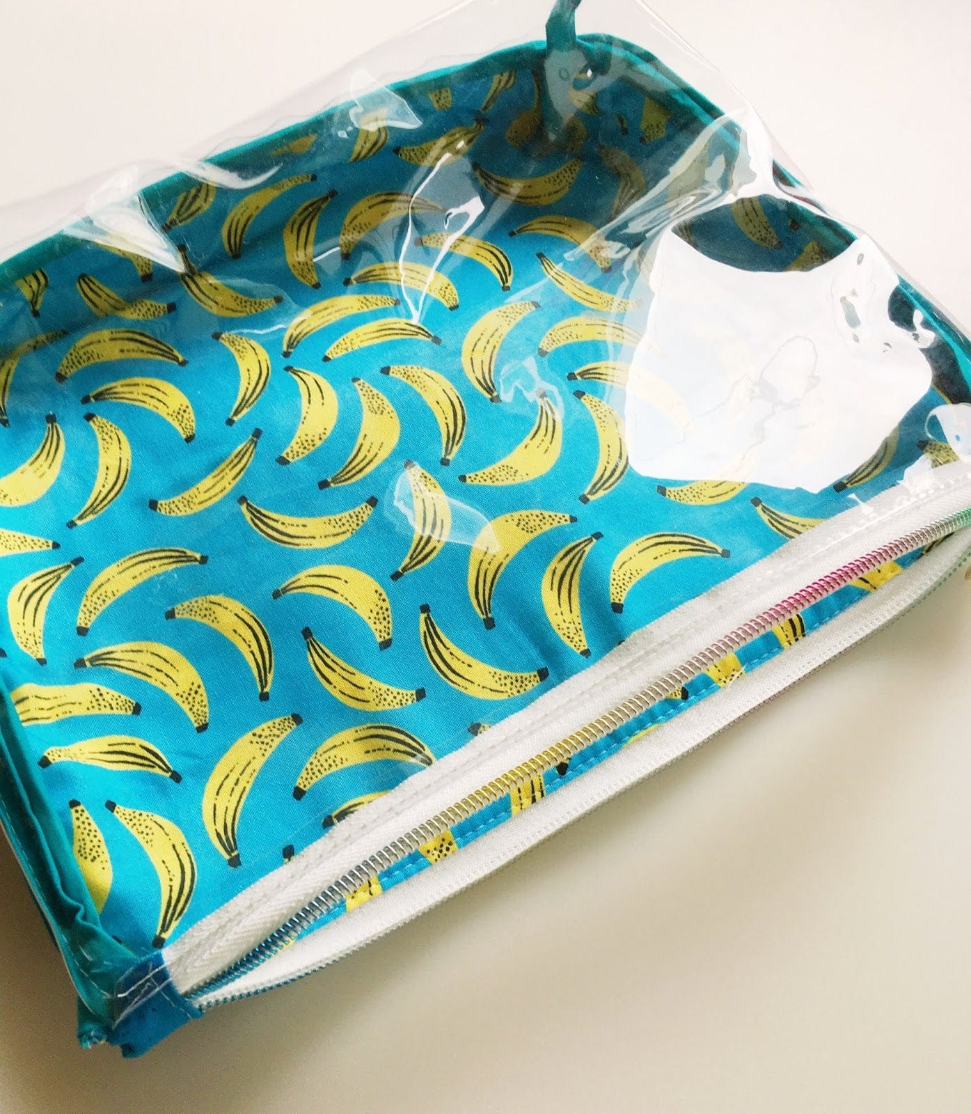 Clear cosmetic bag with banana print.