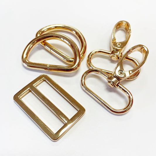 Gold metal hardware pieces.