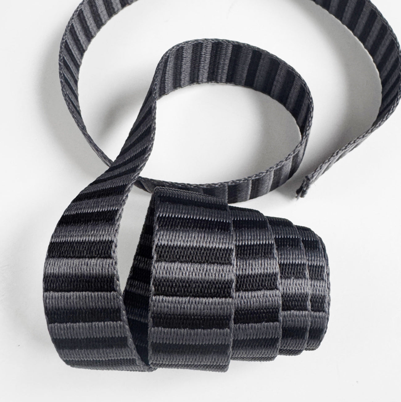 1-inch charcoal and black striped jacquard webbing strap for handmade bags and accessories.