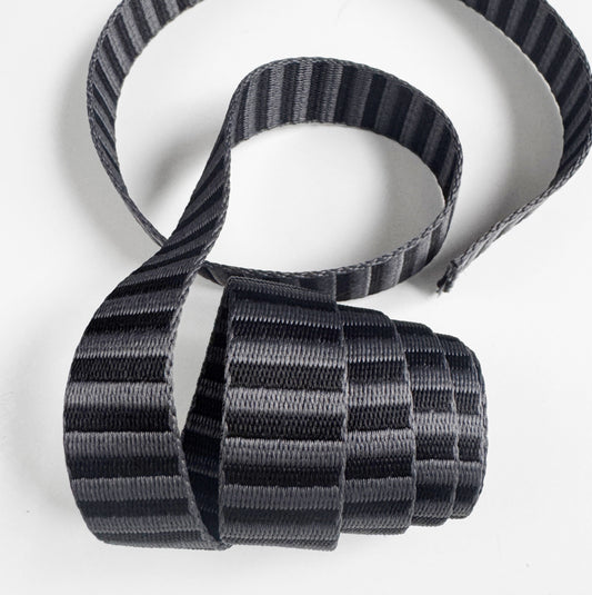 1-inch charcoal and black striped jacquard webbing strap for handmade bags and accessories.