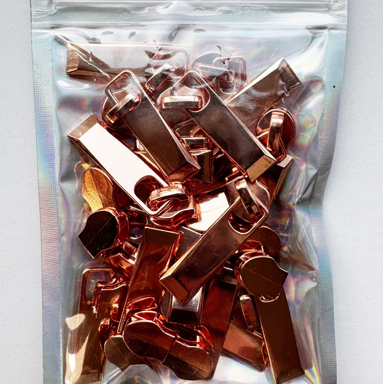 20-pack rose gold zipper pulls for #5 zipper tape, premium bag hardware for sewing and bag making.