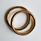 2 gold o-rings on a light gray background