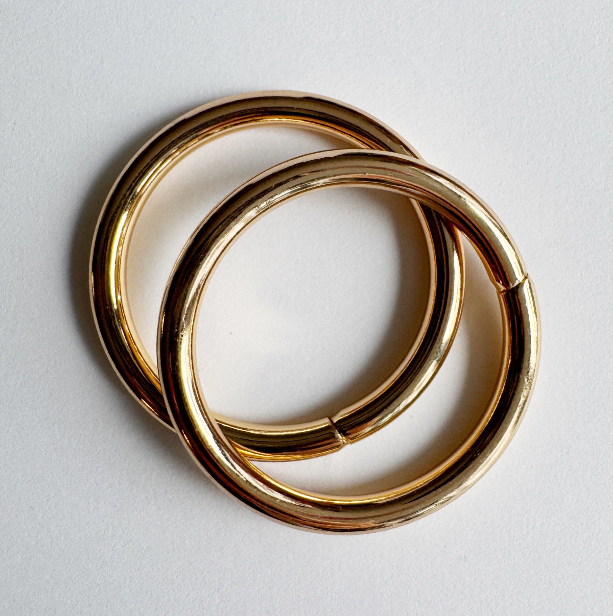 2 gold o-rings on a light gray background
