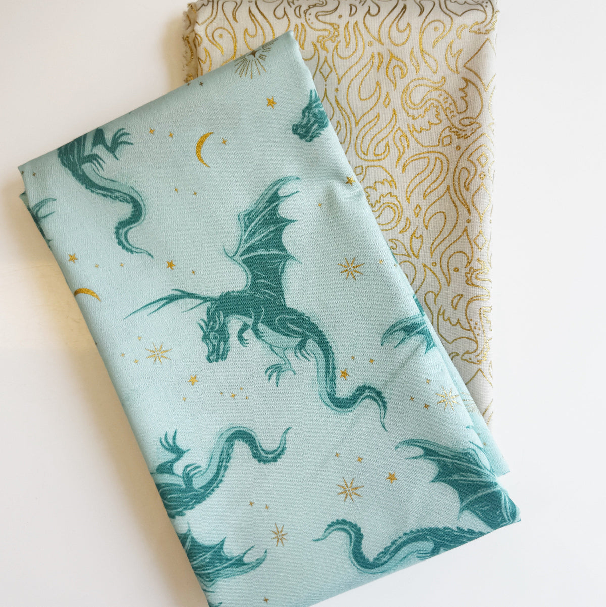 Fabric with dragon pattern on a light blue background