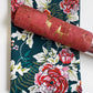 Dark teal cotton fabric with large coral pink floral peony pattern paired with a coordinating salmon pink cork fabric roll featuring metallic gold foil veins for bag making.