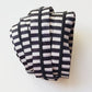 Striped zipper tape and black zipper pulls.