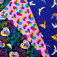 This is the Love Under the Stars fabric collection designed by Katy Tanis for FreeSpirit Fabrics, featuring whimsical lovers owls and rainbow heart patterns