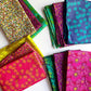 Collection of colorful patterned fabrics on a white background