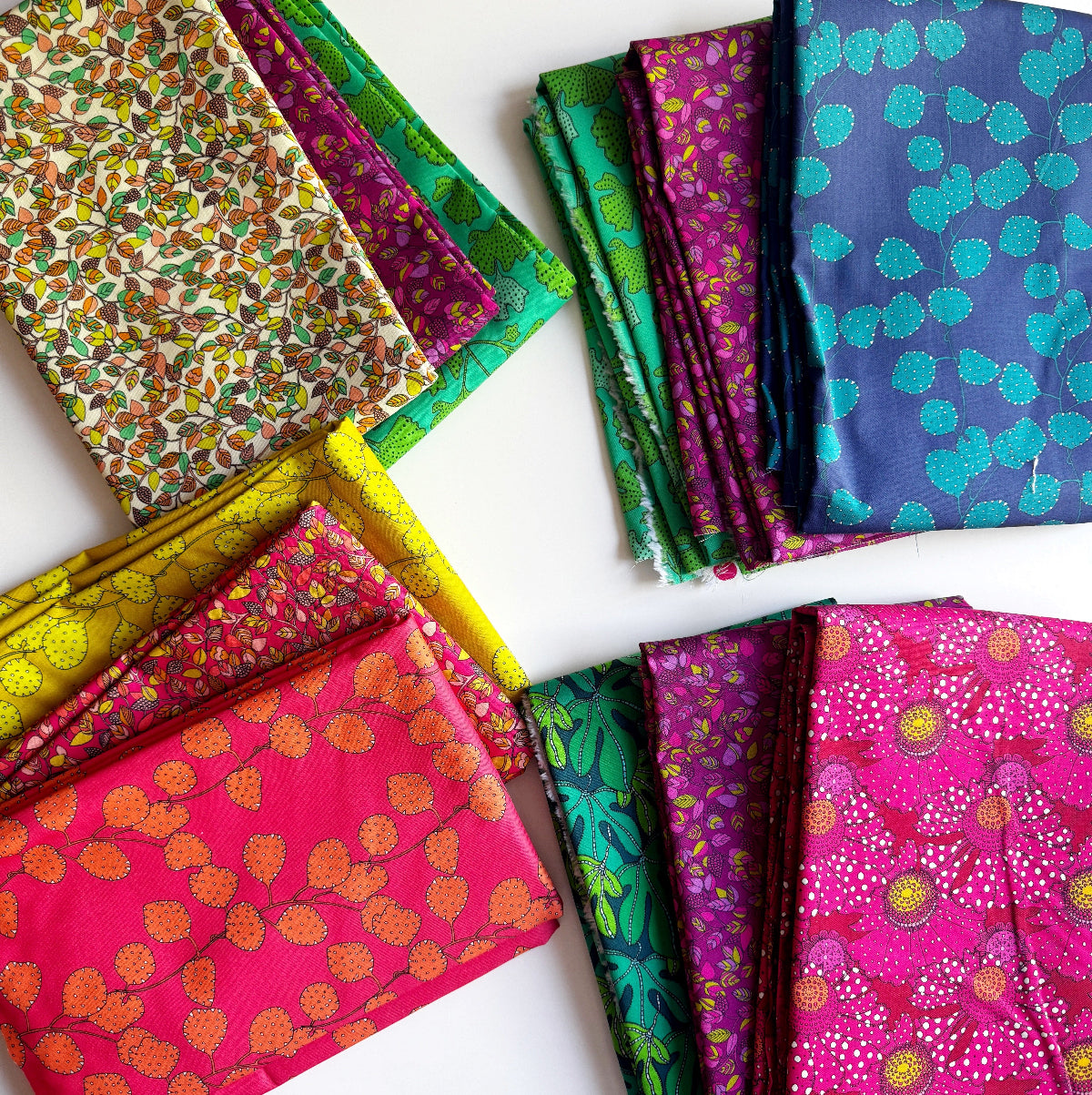 Collection of colorful patterned fabrics on a white background
