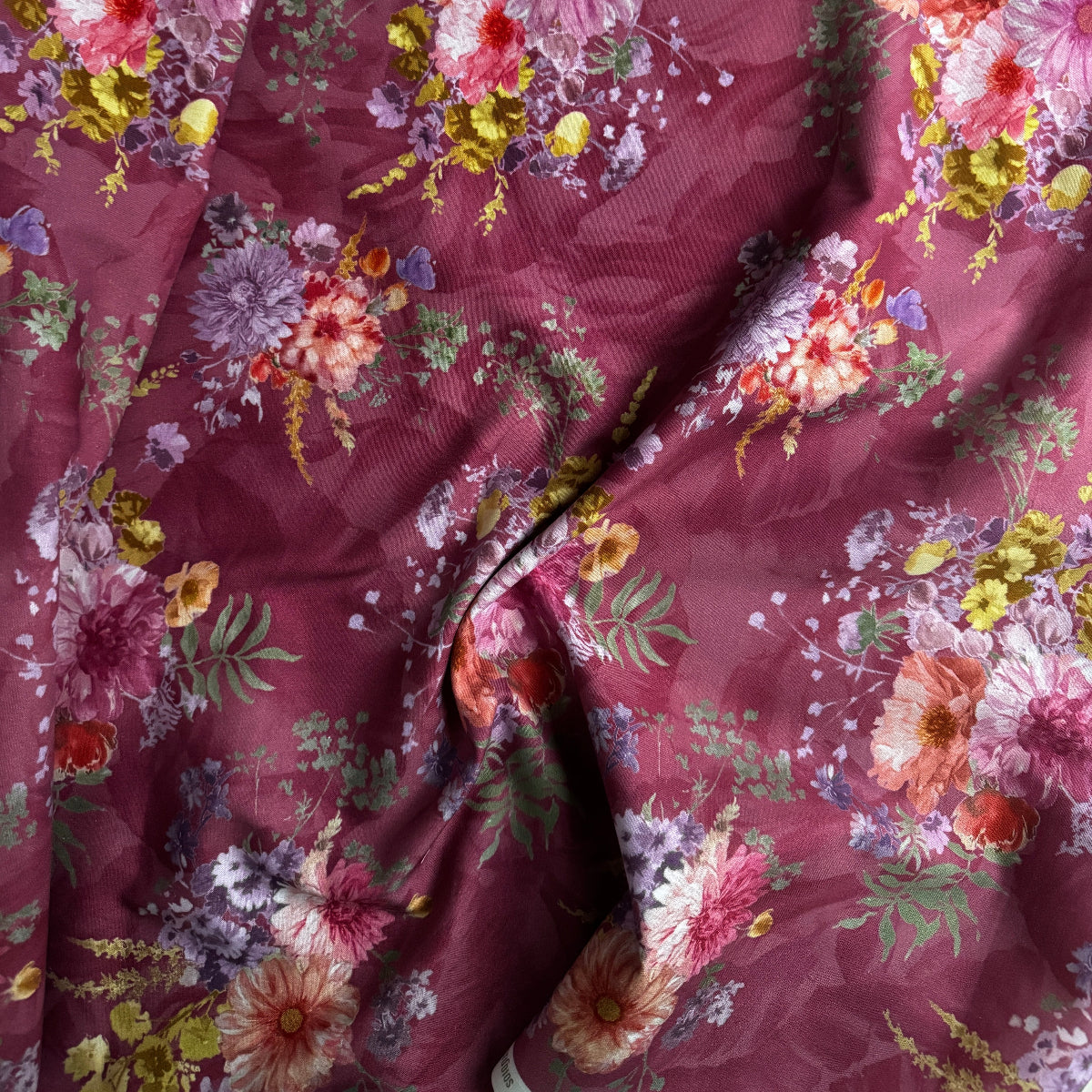 Floral patterned fabric with a prominent purple background