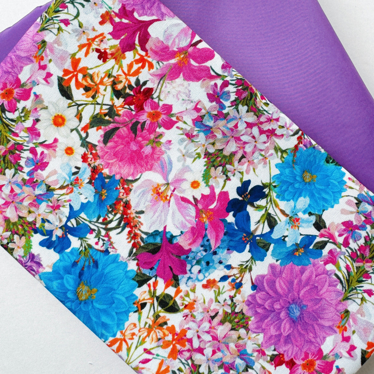 Floral-patterned fabric with vibrant colors on a white background