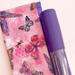A flat-lay view of the craft materials for the Match Up #7 package, showing a folded piece of pink fabric with a butterfly and dragonfly print next to a roll of purple textured "Moonglow" vinyl.