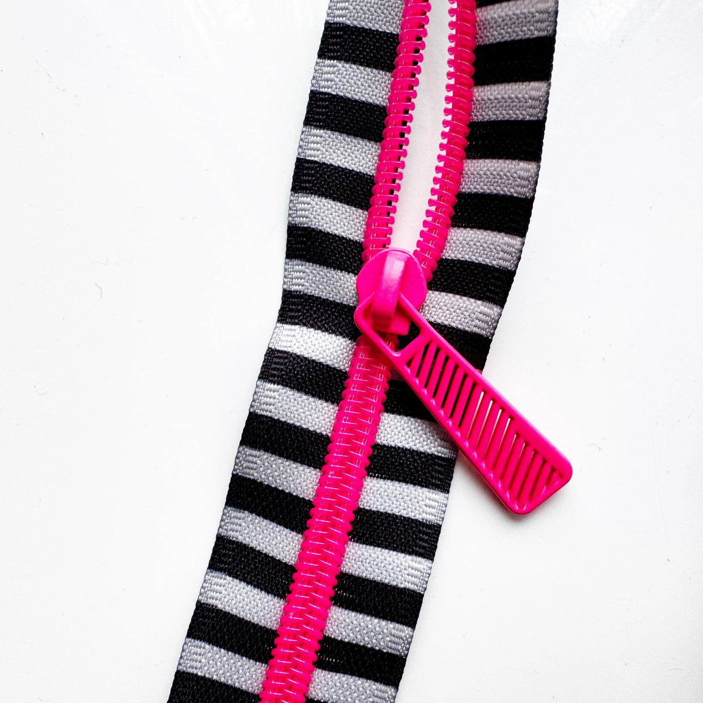 Black and White stripes zipper with neon teeth and pulls