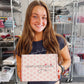 Sew Hungry Hippie owner holding box with products