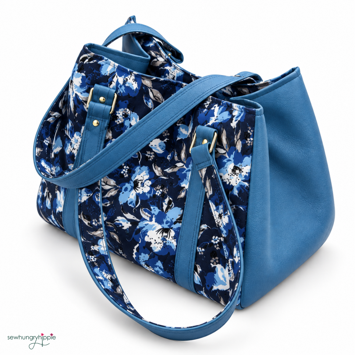 The image shows a handmade blue floral shoulder bag with solid blue side panels and matching blue straps.