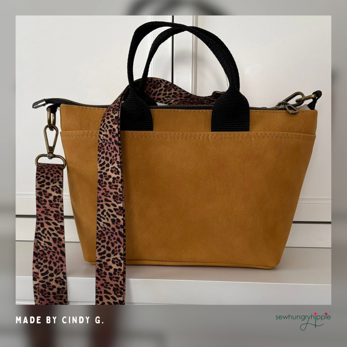Mustard faux leather tote with black handles and leopard print webbing strap, made by Cindy G.