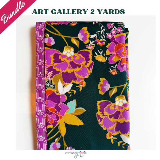 Art Gallery Fabrics two-piece fabric bundle featuring a dark teal quilting cotton with large, vibrant purple, magenta, and orange floral prints, paired with a coordinating magenta geometric wavy border fabric