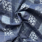 Navy blue fabric with white geometric patterns