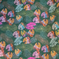 Colorful tropical leaf pattern on a green background