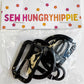 Black 1.5-inch width, 5-piece hardware set by Sew HungryHippie in plastic packaging.