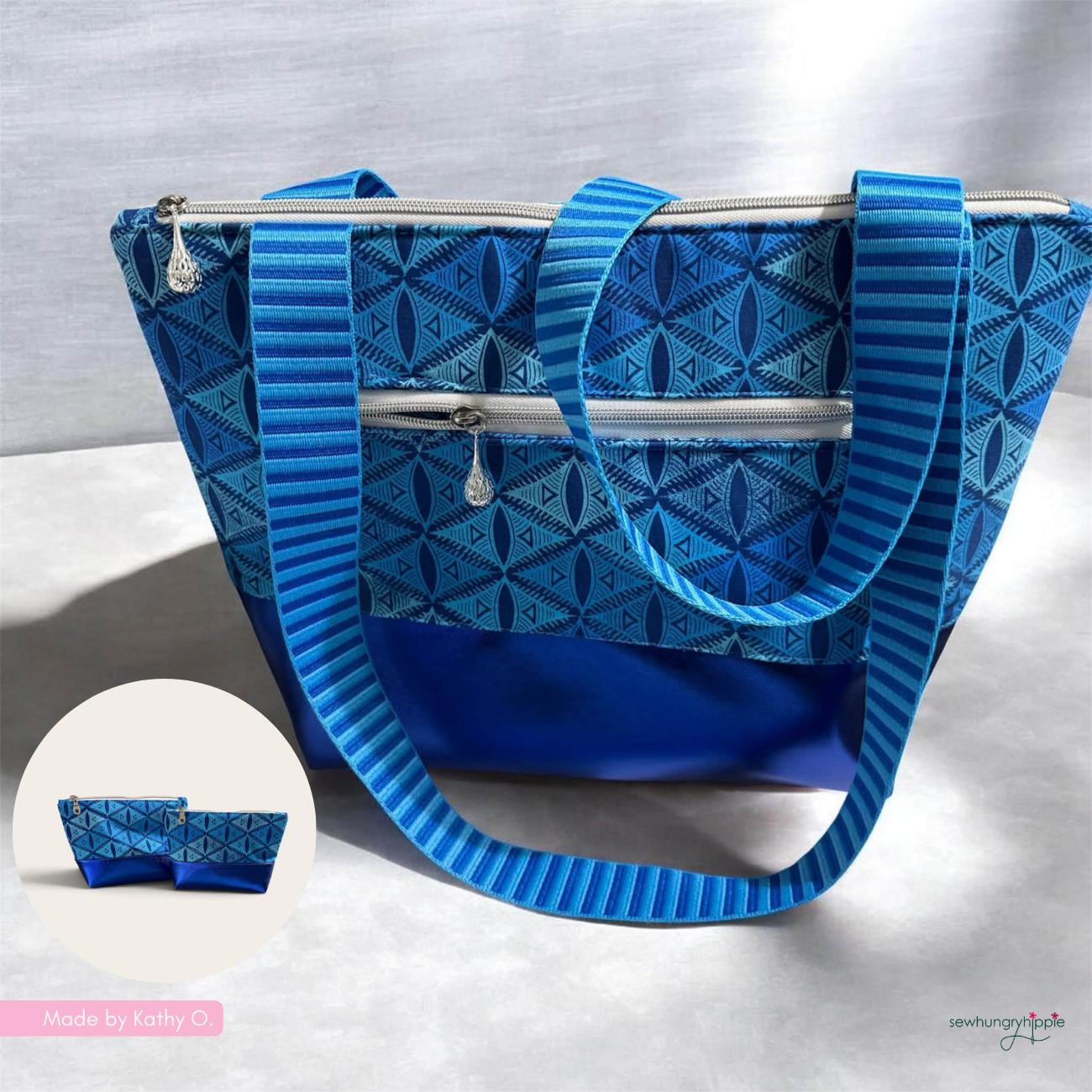 A blue patterned tote bag with matching shoulder straps and a zippered front pocket, shown on a light fabric backdrop. A small circular inset at lower left shows a matching zip pouch, and a small 'Made by Kathy O' credit appears in the bottom left corner.