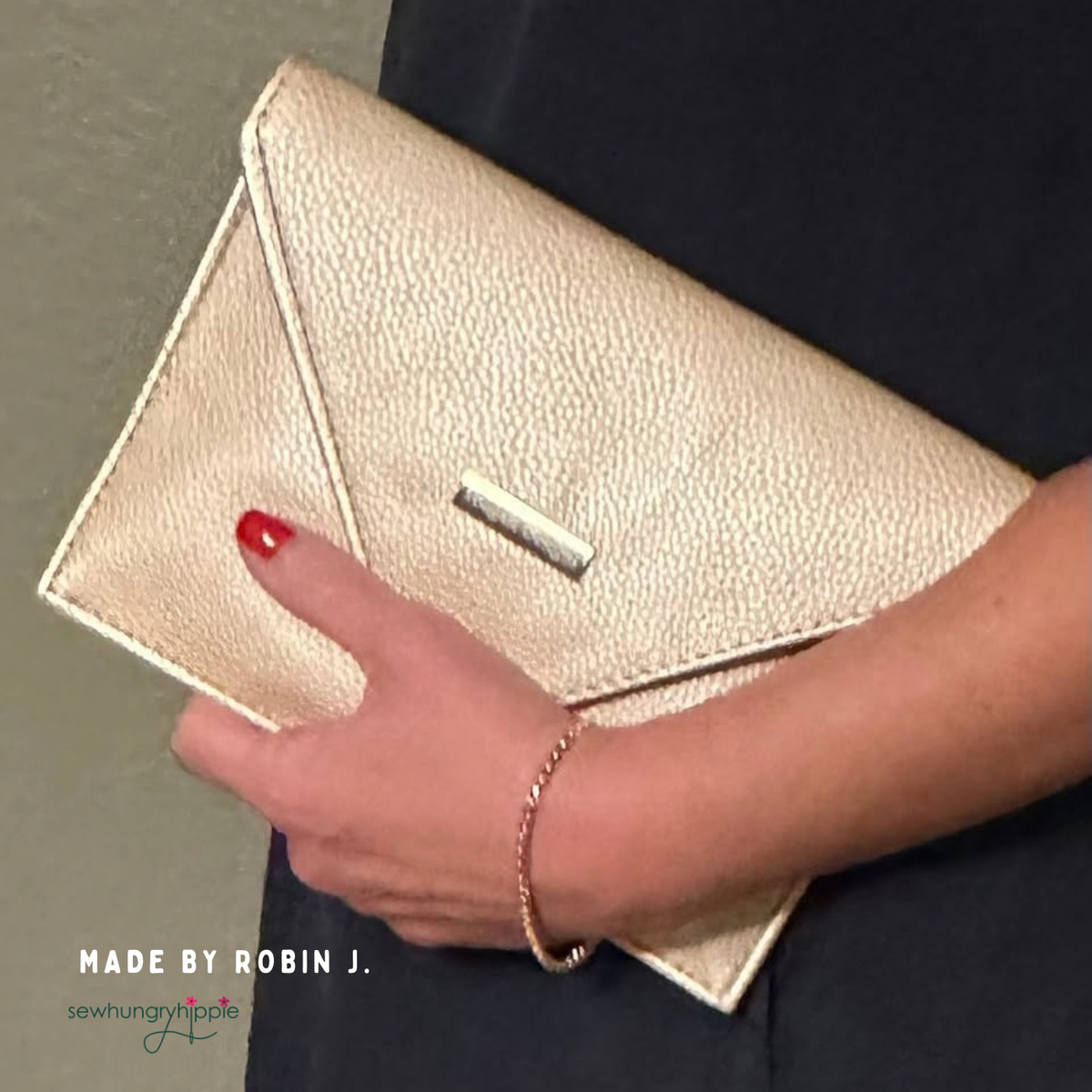 Champagne Moonglow vinyl envelope clutch held in hand, made by Robin J.