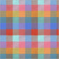 Seamless full-bleed pattern of a large-scale rainbow check plaid fabric. The woven texture shows intersecting blocks of coral red, orange, golden yellow, Kelly green, teal, sky blue, purple, and bright pink.