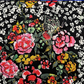 High-quality rayon challis fabric featuring pink, orange, and white floral motifs with butterflies on dark navy black base.