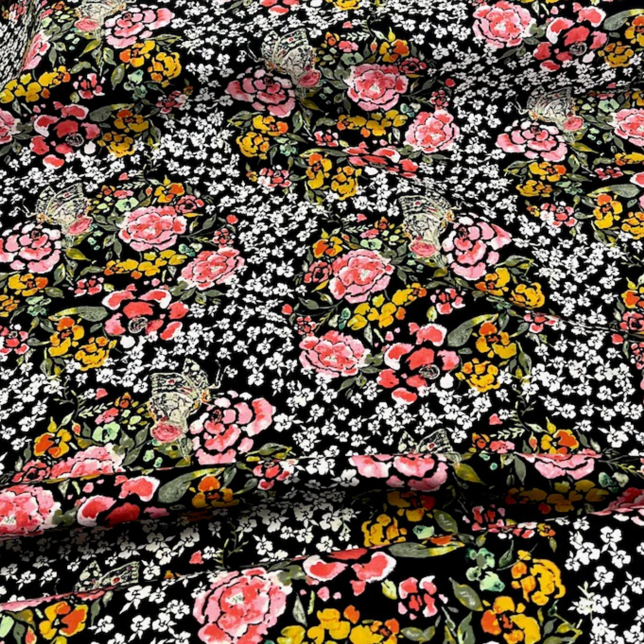 Closed-up image of Art Gallery Fabrics Eve Jardin Robust Rayon, floral print with pink roses and yellow wildflowers on black background.