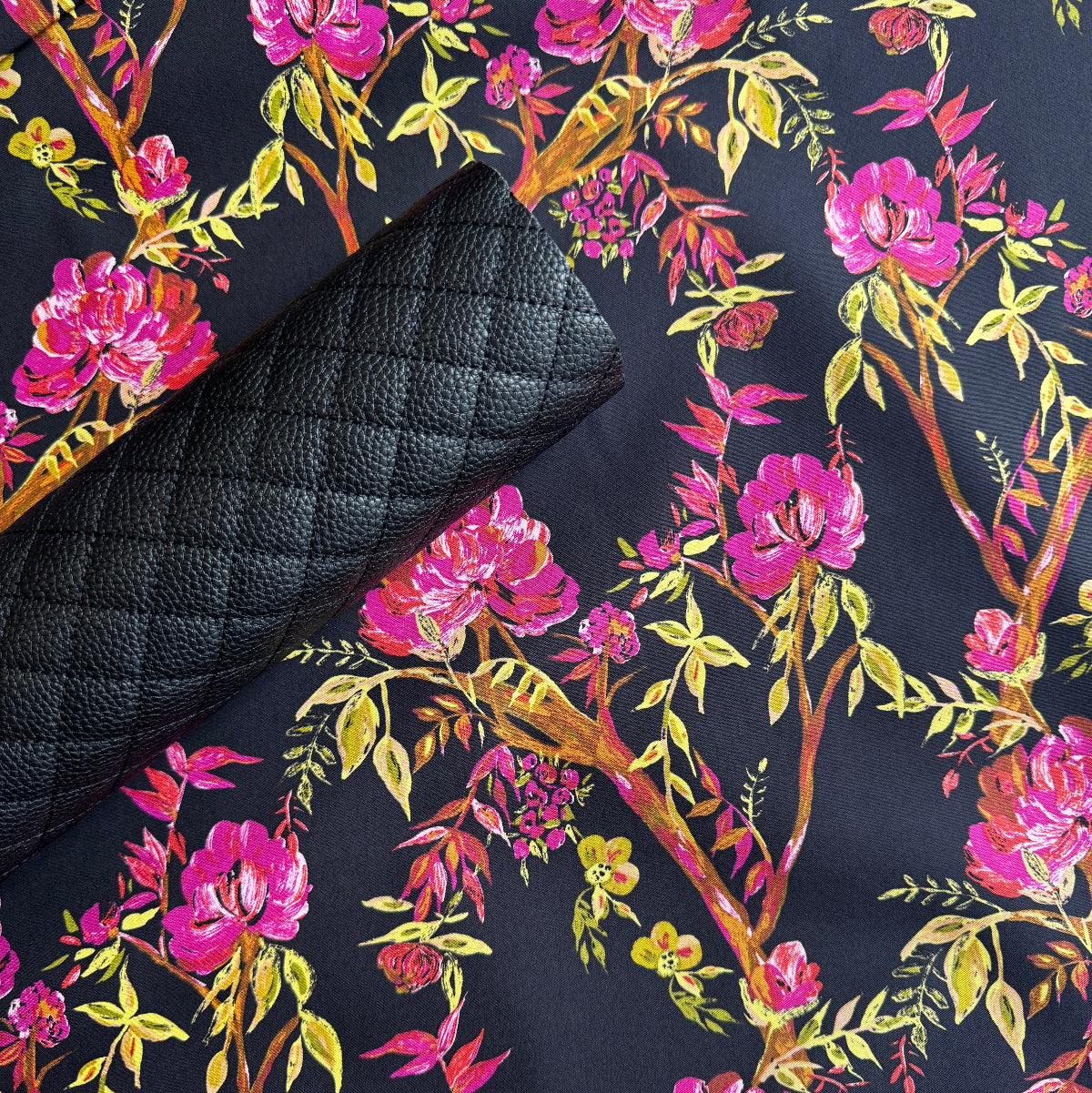 Art Gallery Fabrics Betty Ann’s Glamour floral cotton next to black diamond quilted pre-quilted vinyl