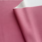 Close-up of pink leather fabric with a white edge