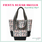 A handmade tote bag and matching pouch featuring a "Fiesta Sugar Skulls" printed vinyl fabric by SewHungryhippie.