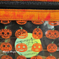 clear vinyl sewing project featuring happy jack o lantern print for pouches and totes