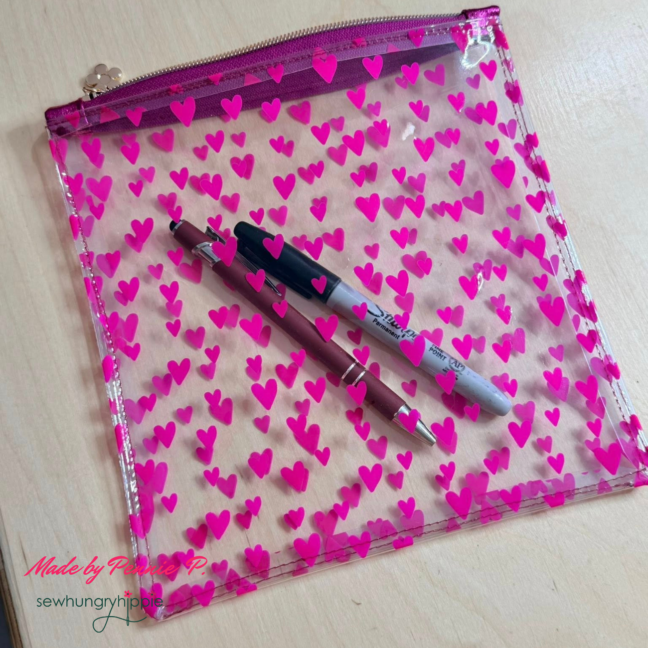 zipper pouch made with hot pink heart TPU vinyl fabric